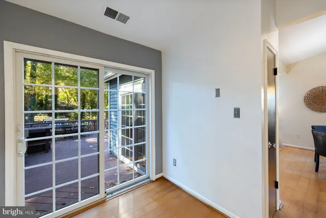 a kitchen with sink a microwave and cabinets