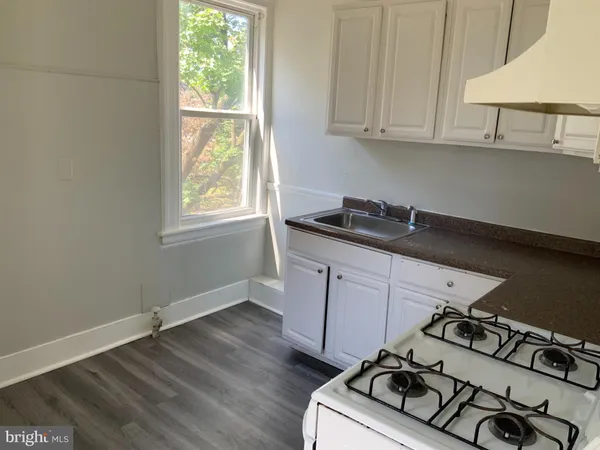 a kitchen with a stove and a microwave