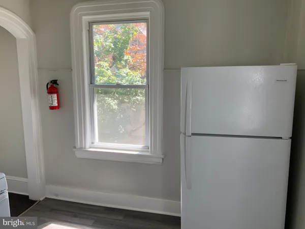 a white refrigerator freezer sitting inside of a kitchen