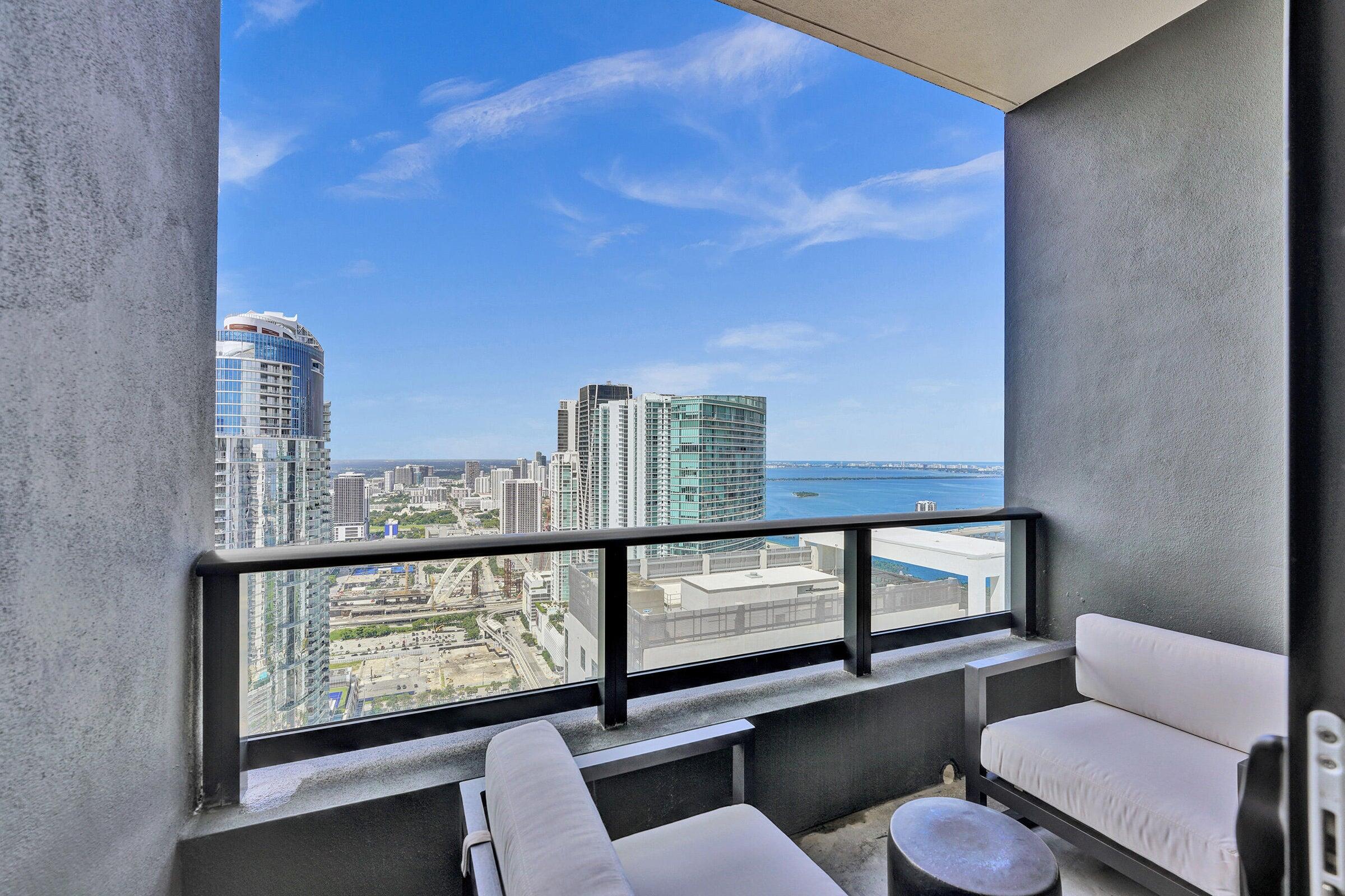 159 Northeast 6th Street, Unit 4813 Miami, FL 33132 - Photo 16 of 34 a view of a balcony with chairs