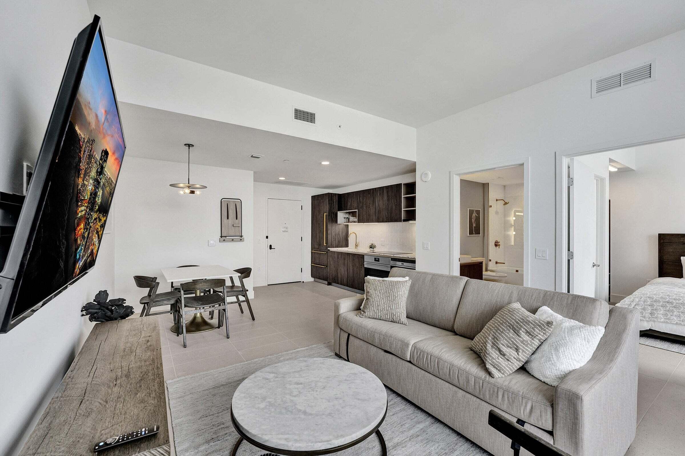 159 Northeast 6th Street, Unit 4813 Miami, FL 33132 - Photo 5 of 34 a living room with furniture and a flat screen tv