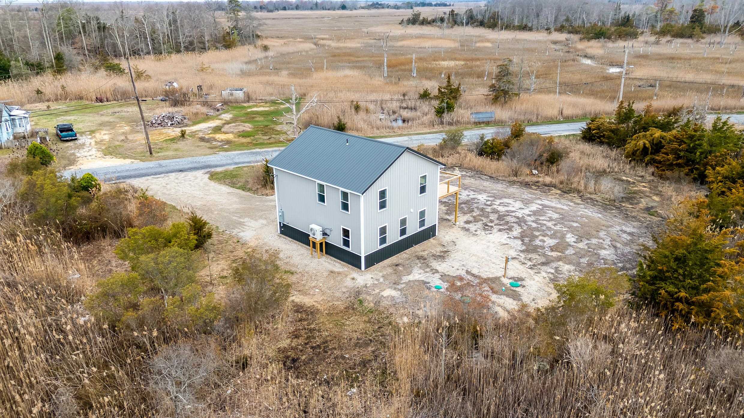 22 Moores Beach Road Delmont, NJ 08314 - Photo 17 of 18 a view of a yard with wooden fence