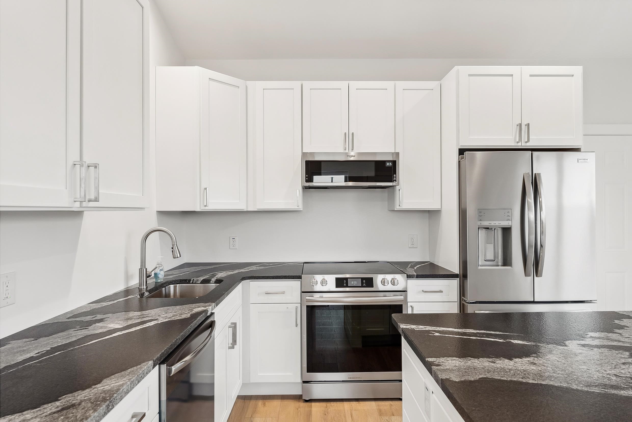 22 Moores Beach Road Delmont, NJ 08314 - Photo 4 of 18 a kitchen with stainless steel appliances granite countertop a sink stove and refrigerator