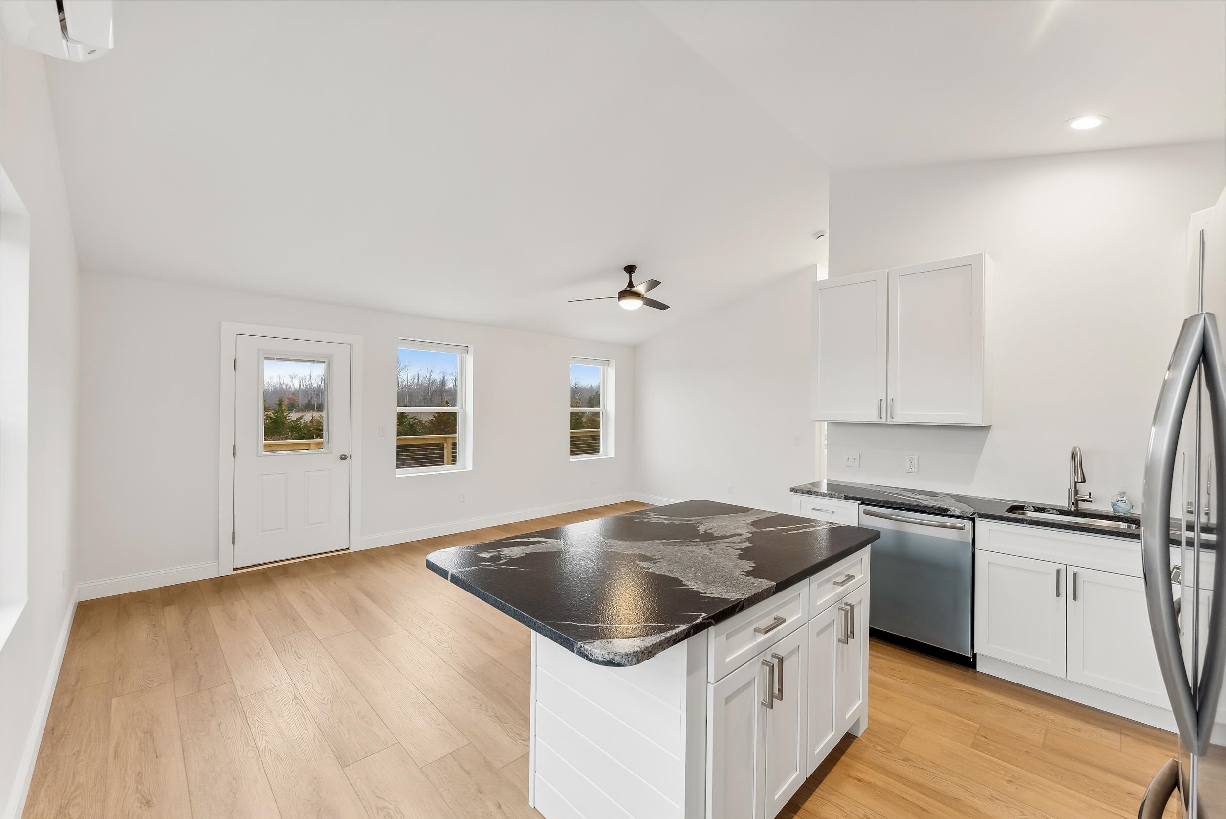 22 Moores Beach Road Delmont, NJ 08314 - Photo 5 of 18 a kitchen with a sink stove and cabinets