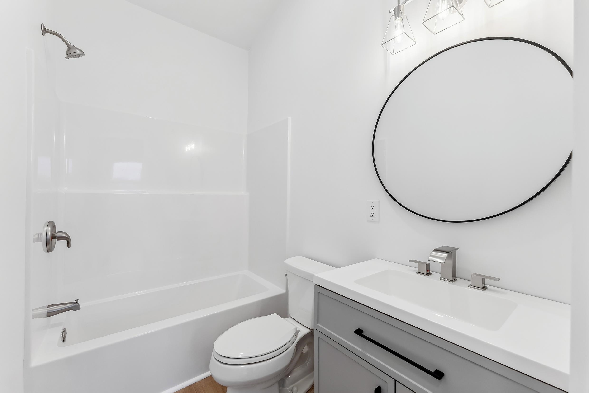 22 Moores Beach Road Delmont, NJ 08314 - Photo 6 of 18 a bathroom with a sink a toilet and a mirror