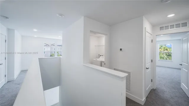 a view of kitchen with furniture and wooden floor