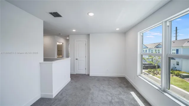 a view of hallway with a large window