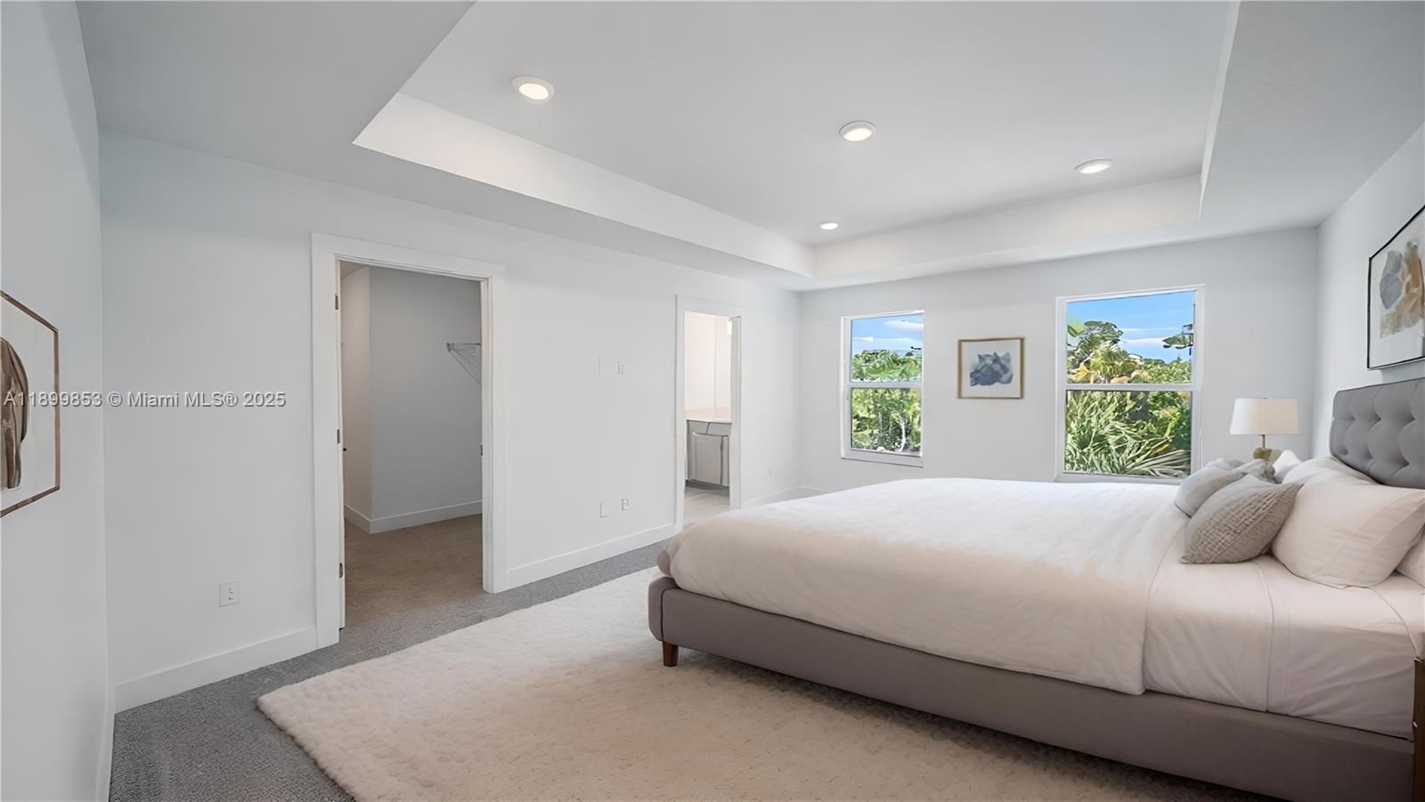 241 Preserve Trail North Stuart, FL 34994 - Photo 20 of 37 a bedroom with a large bed and a window