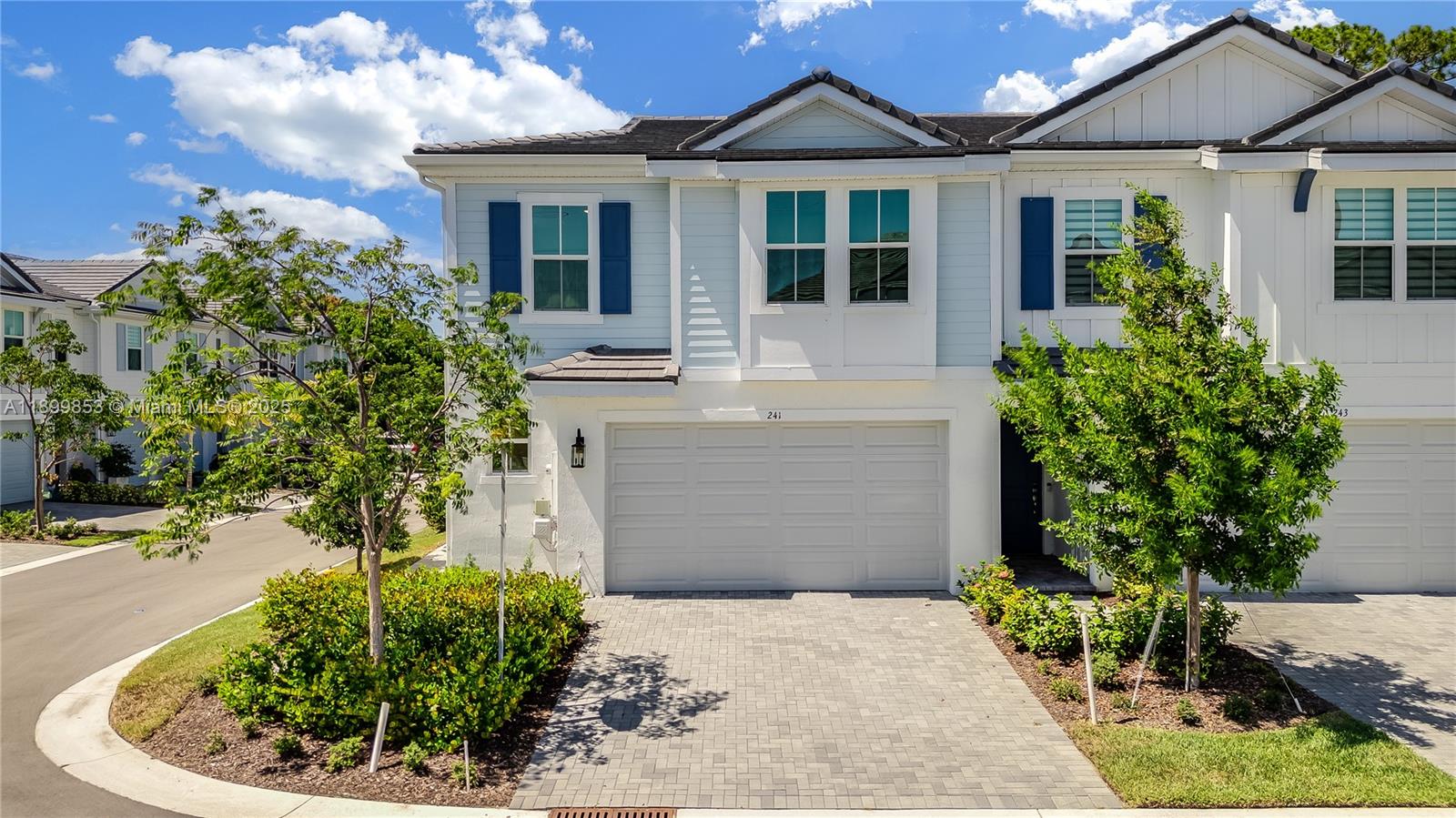 241 Preserve Trail North Stuart, FL 34994 - Photo 2 of 37 a front view of a house with garden