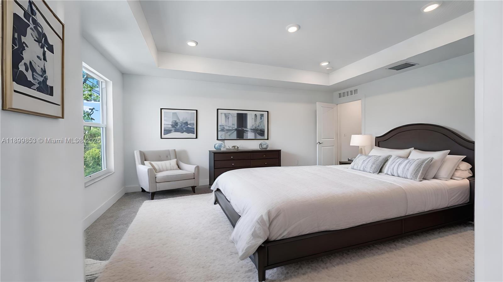 241 Preserve Trail North Stuart, FL 34994 - Photo 25 of 37 a bedroom with a bed couch and window