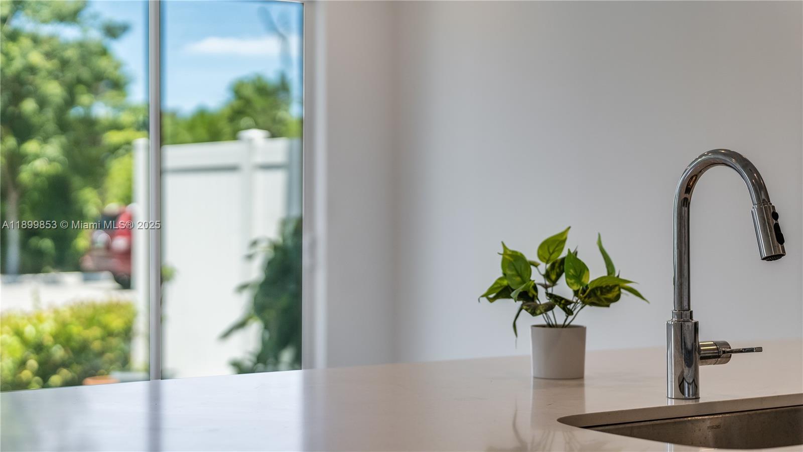 241 Preserve Trail North Stuart, FL 34994 - Photo 10 of 37 a vase of flowers sitting on a table with wooden floor