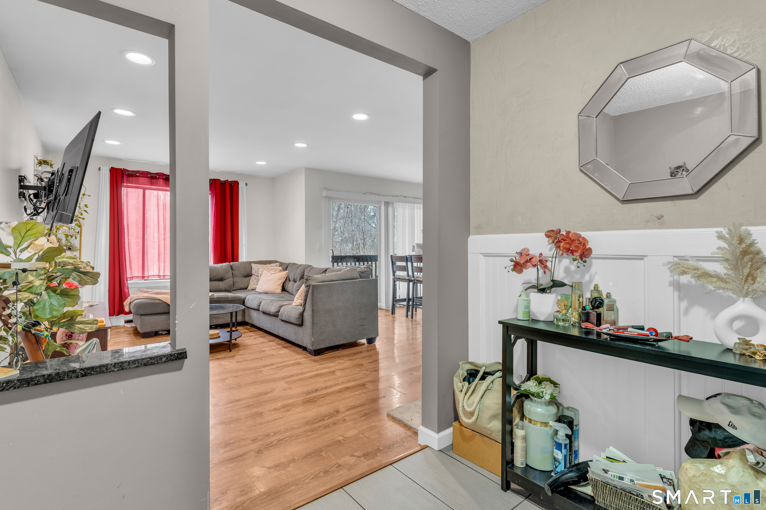 175 Mill Pond Road, Unit 444 Hamden, CT 06514 - Photo 1 of 38 a living room with furniture and flowers