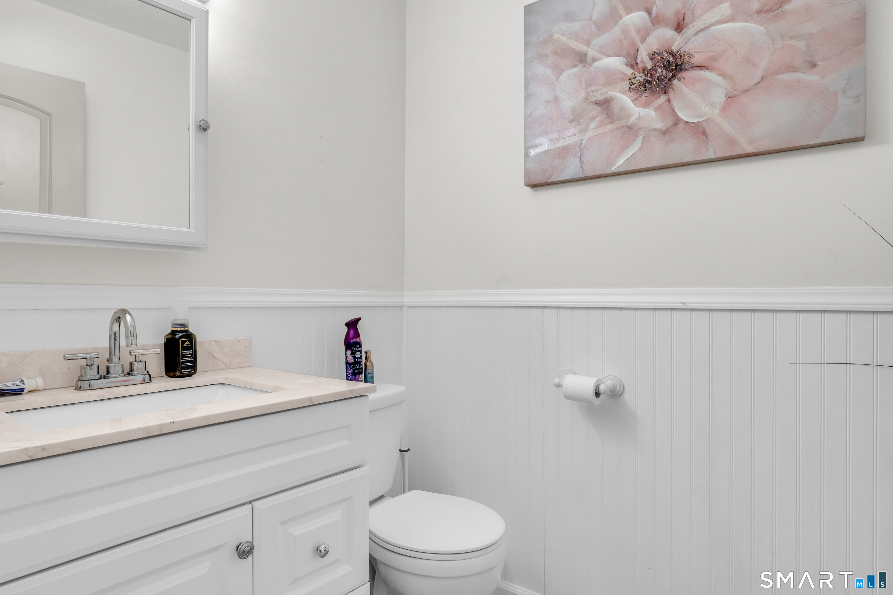 175 Mill Pond Road, Unit 444 Hamden, CT 06514 - Photo 20 of 38 a bathroom with a sink a toilet and a mirror