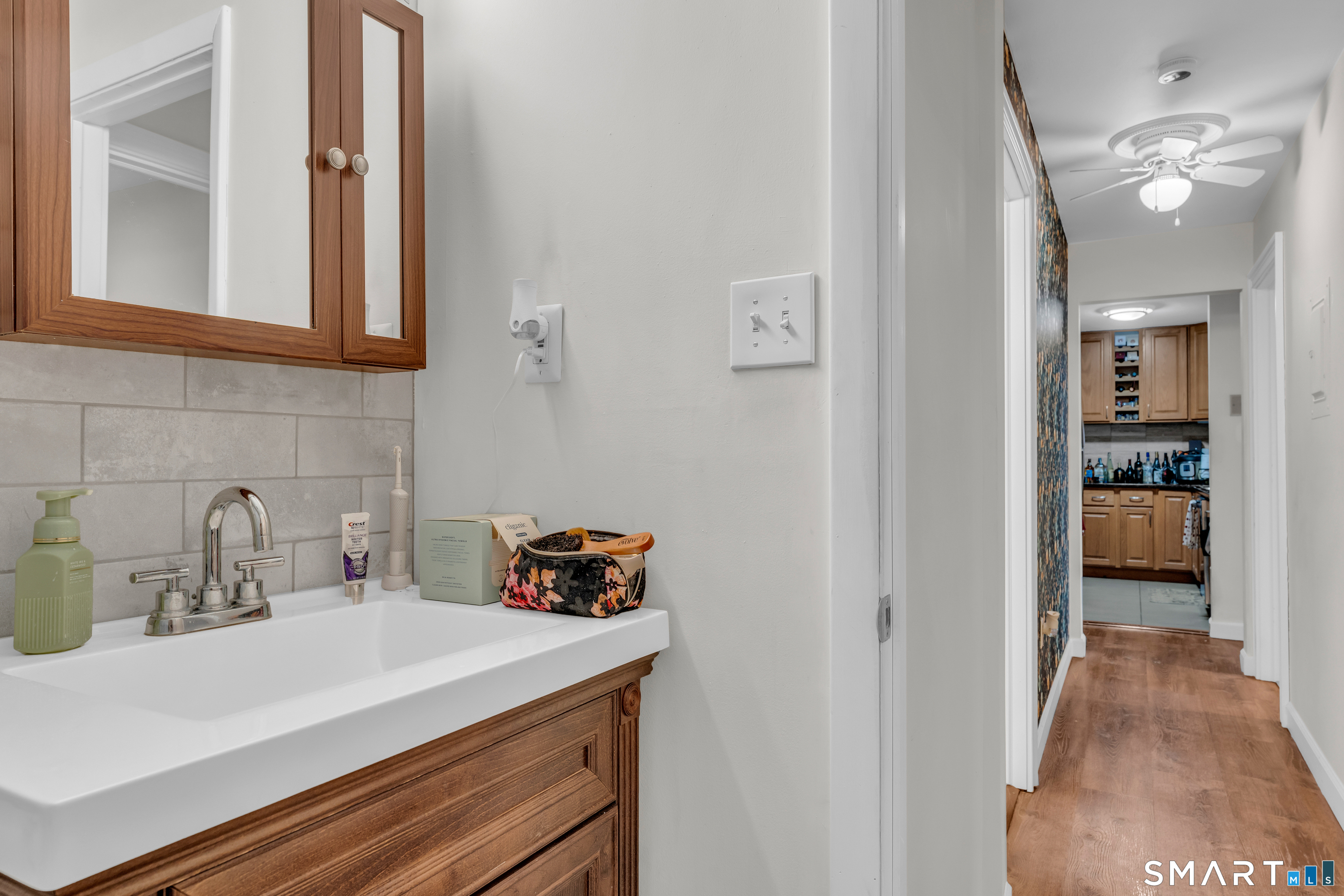 175 Mill Pond Road, Unit 444 Hamden, CT 06514 - Photo 22 of 38 a kitchen with a sink and a refrigerator