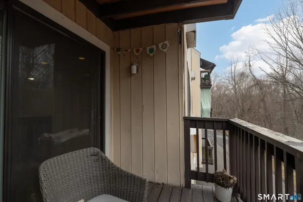 a balcony with wooden floor