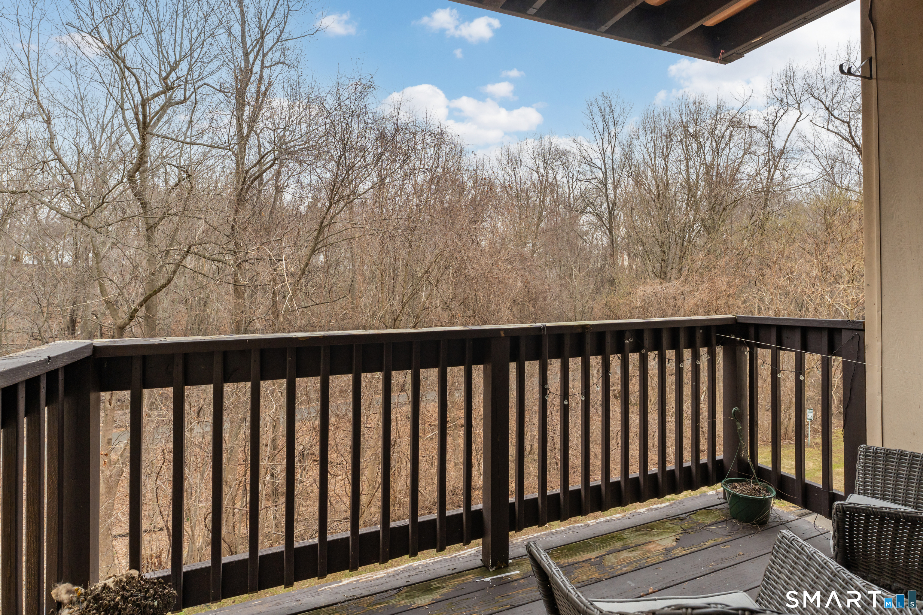 175 Mill Pond Road, Unit 444 Hamden, CT 06514 - Photo 26 of 38 a balcony with wooden floor
