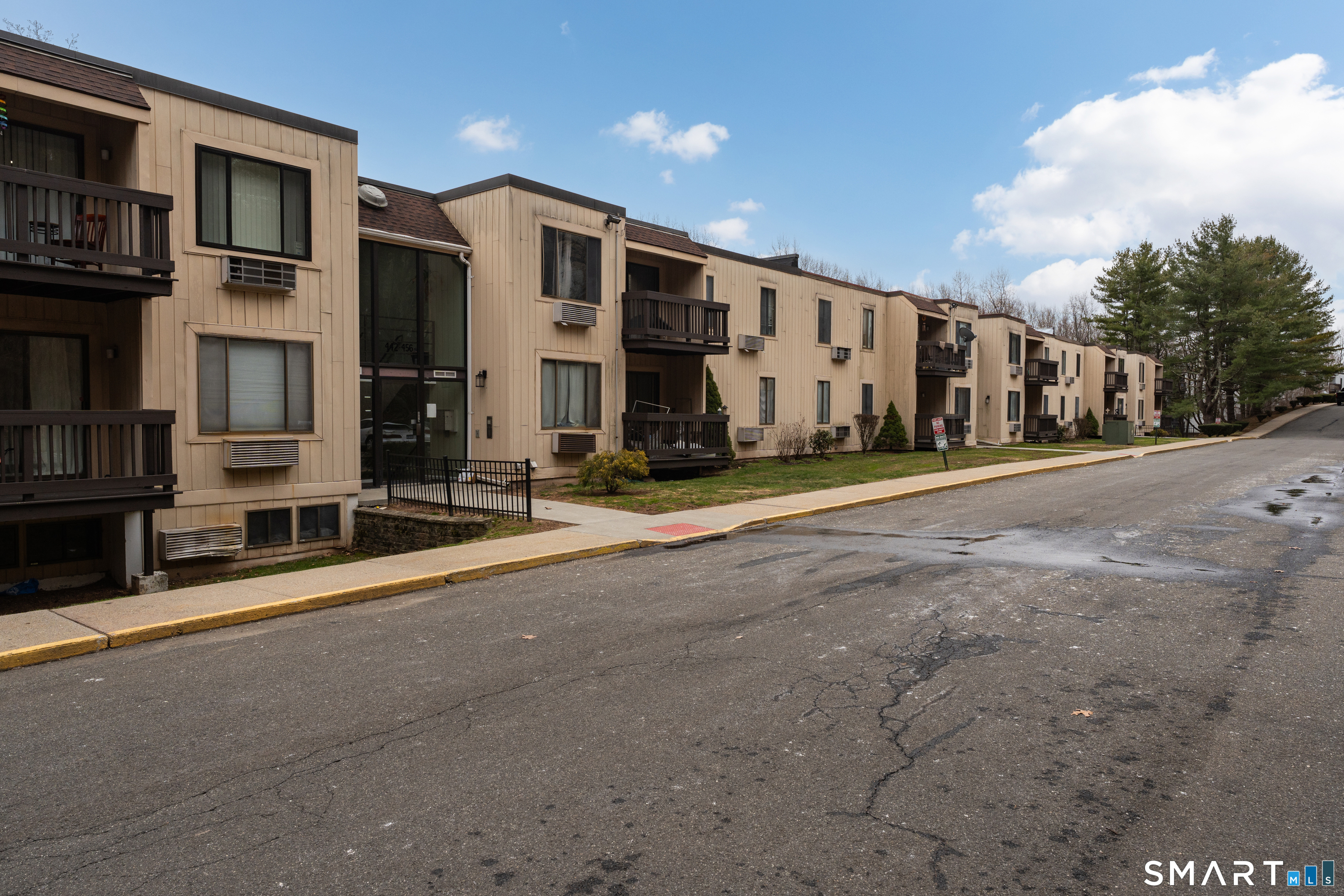 175 Mill Pond Road, Unit 444 Hamden, CT 06514 - Photo 29 of 38 a view of a building with street