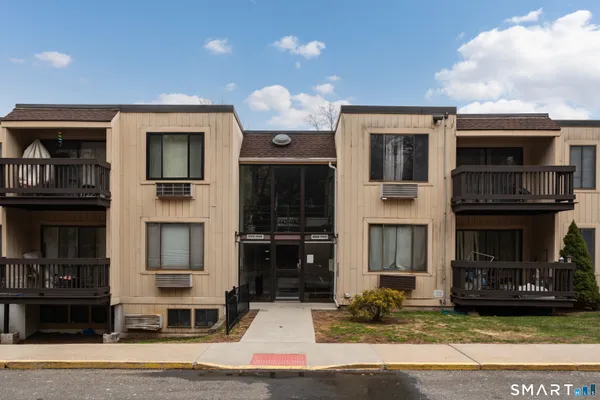 a front view of a house with garage