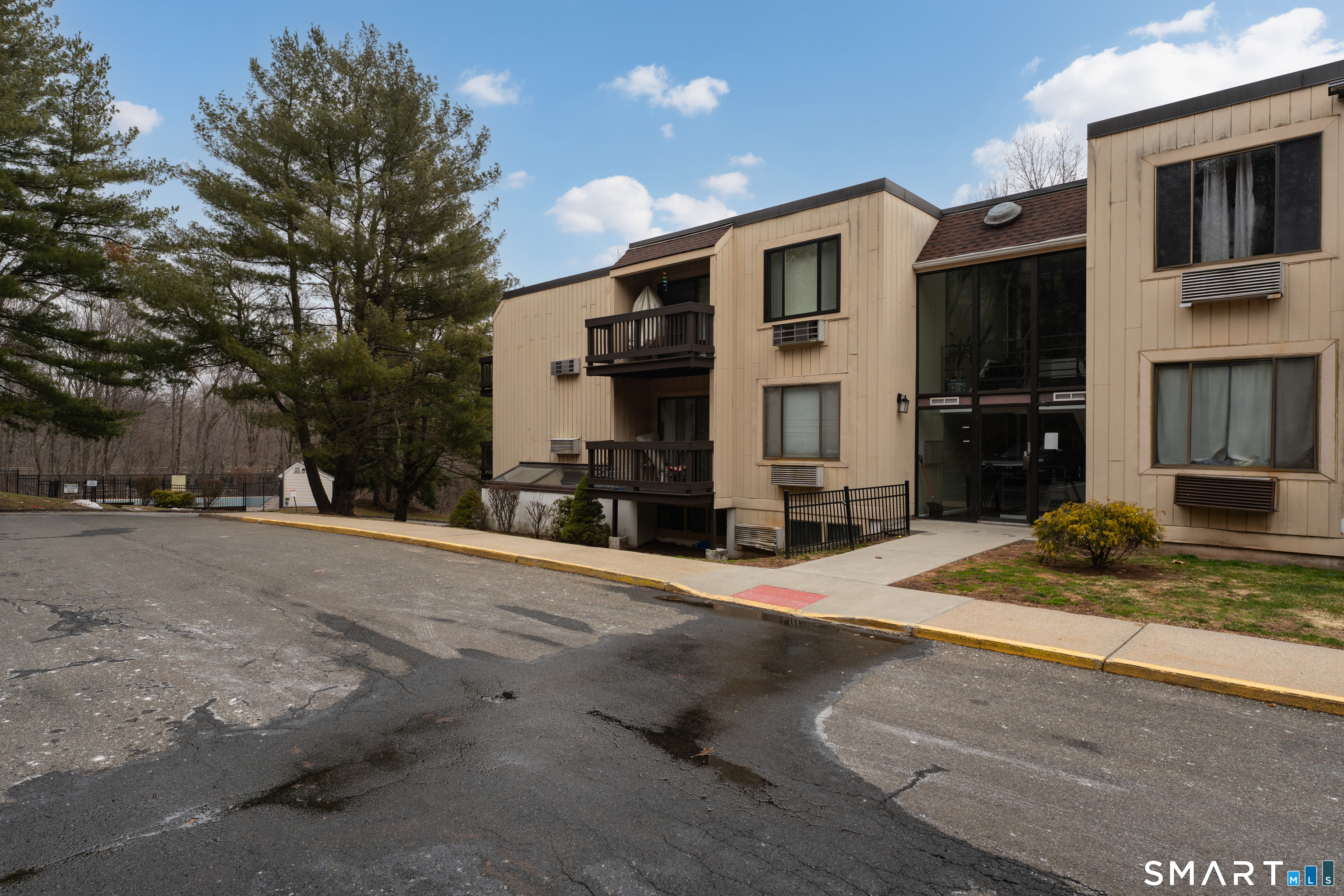 175 Mill Pond Road, Unit 444 Hamden, CT 06514 - Photo 31 of 38 a front view of a house with garage