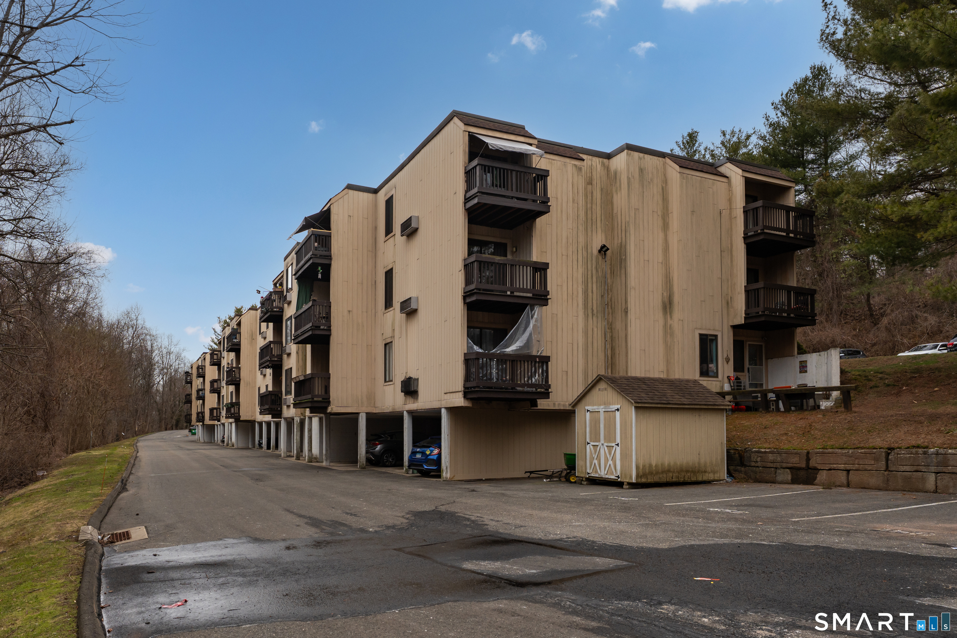 175 Mill Pond Road, Unit 444 Hamden, CT 06514 - Photo 32 of 38 a view of a street with tall buildings