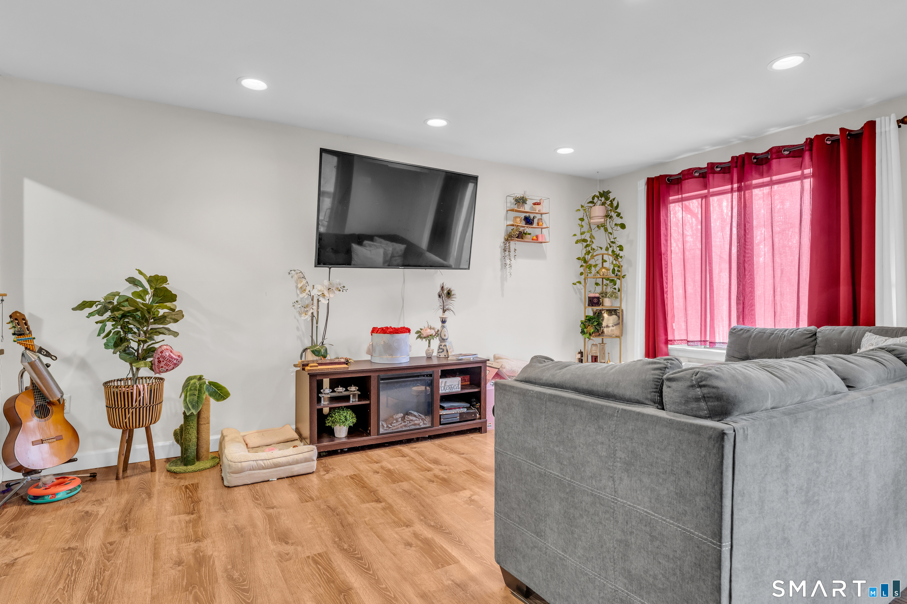 175 Mill Pond Road, Unit 444 Hamden, CT 06514 - Photo 4 of 38 a living room with furniture and a flat screen tv