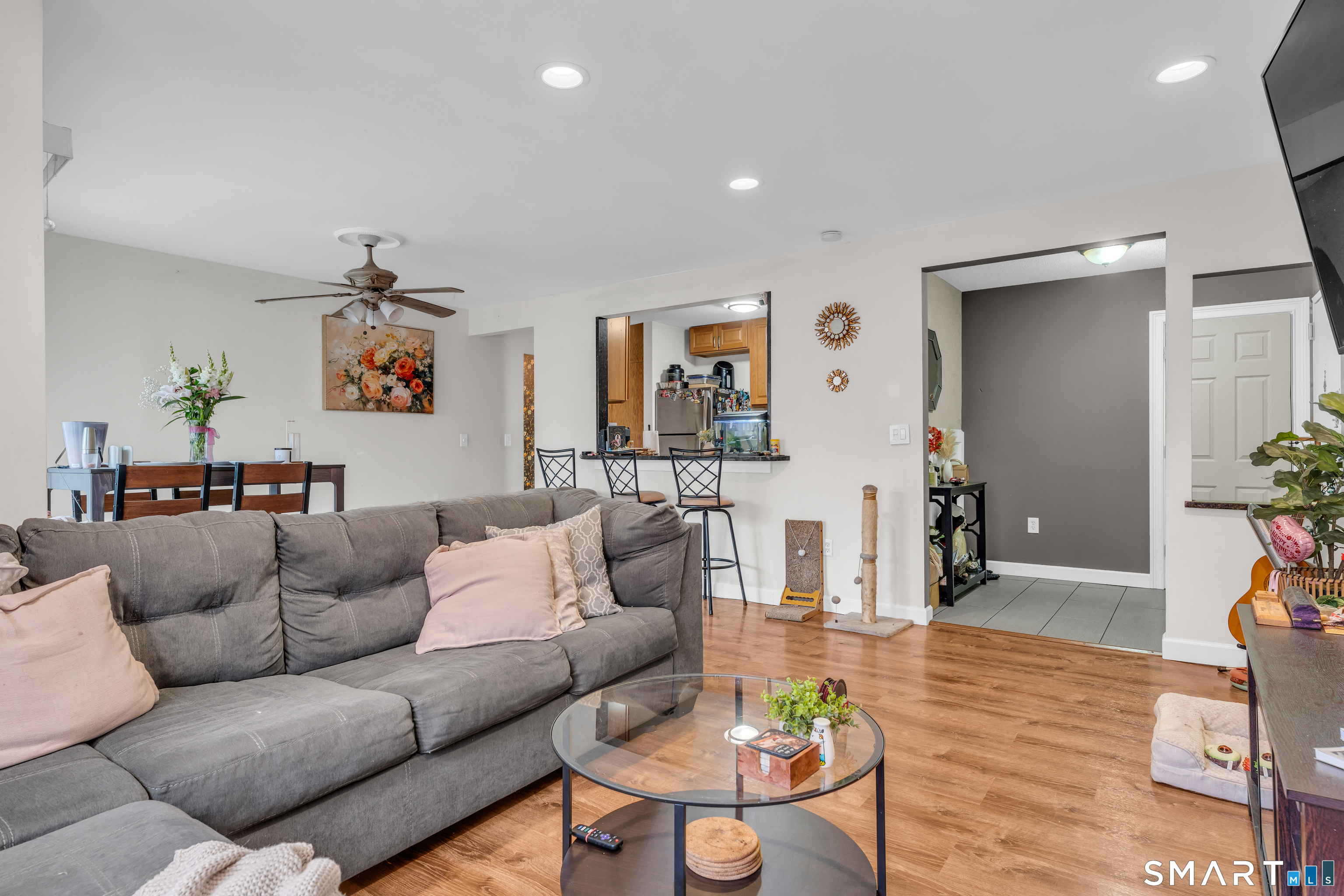 175 Mill Pond Road, Unit 444 Hamden, CT 06514 - Photo 5 of 38 a living room with furniture and wooden floor
