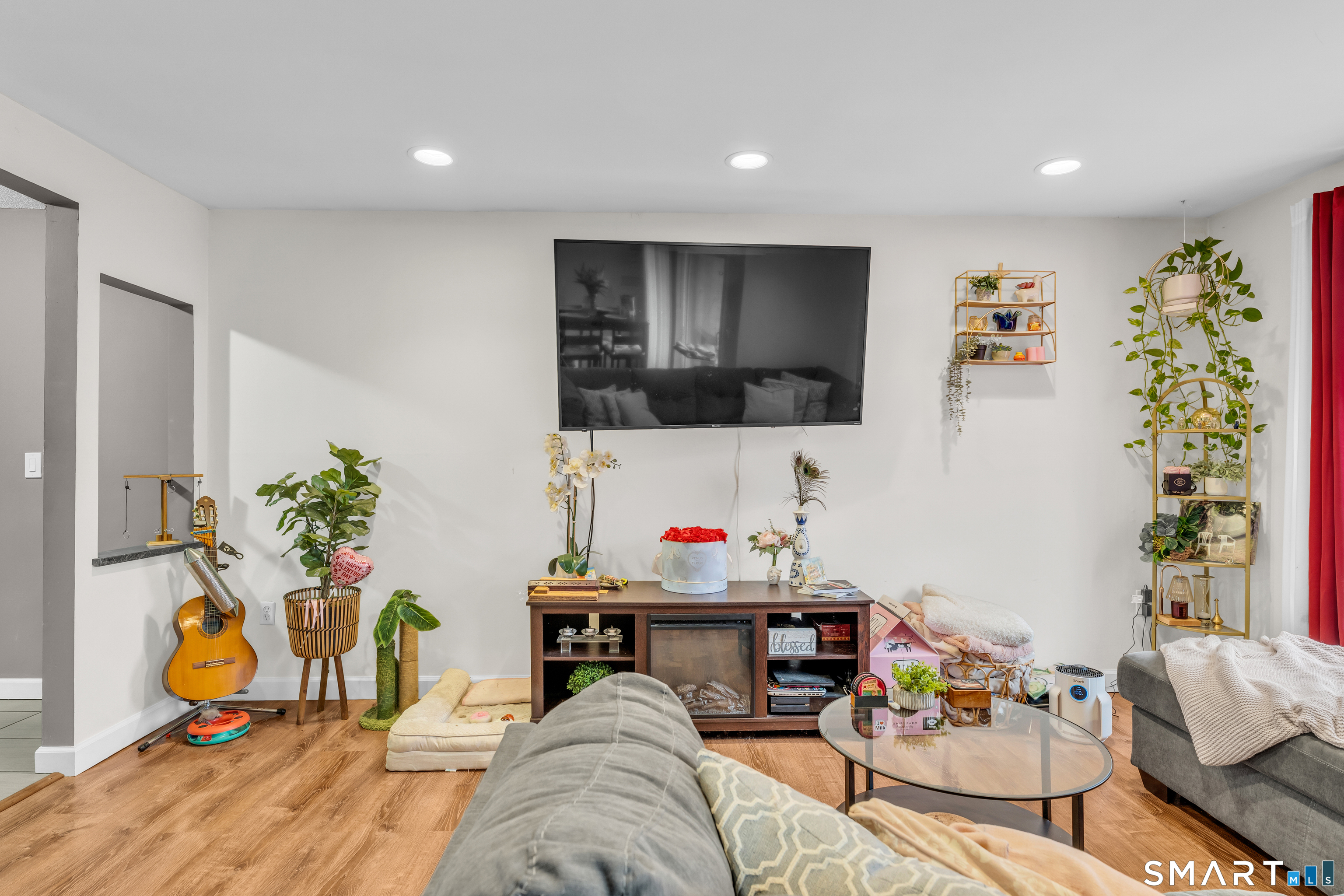 175 Mill Pond Road, Unit 444 Hamden, CT 06514 - Photo 6 of 38 a living room with furniture and a flat screen tv