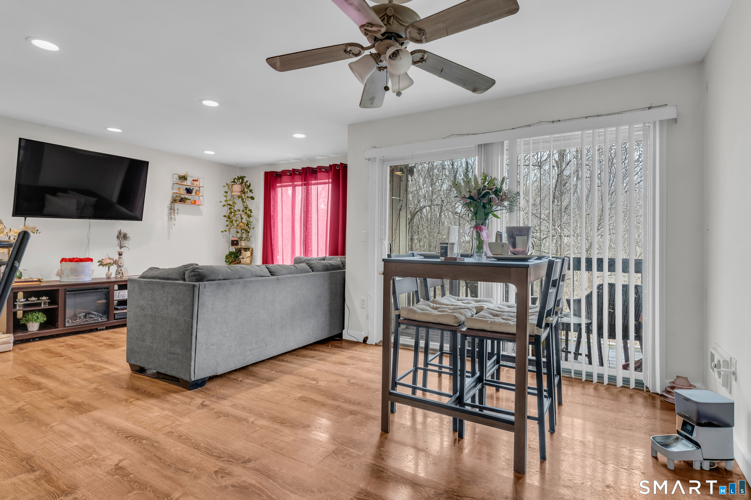 175 Mill Pond Road, Unit 444 Hamden, CT 06514 - Photo 7 of 38 a living room with furniture and a flat screen tv