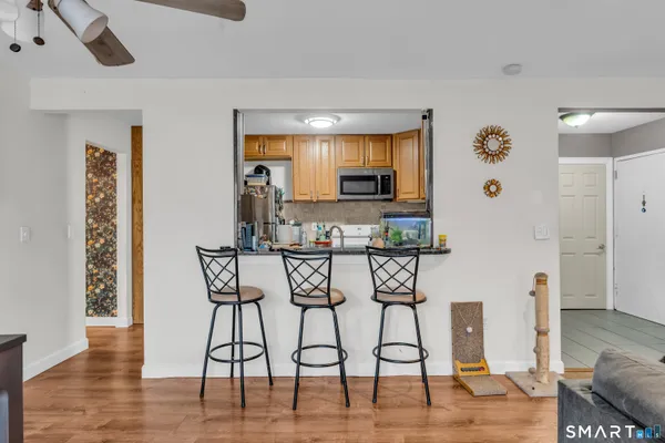 a view of a dining room with furniture and wooden floor
