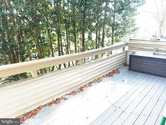 a view of a balcony with trees