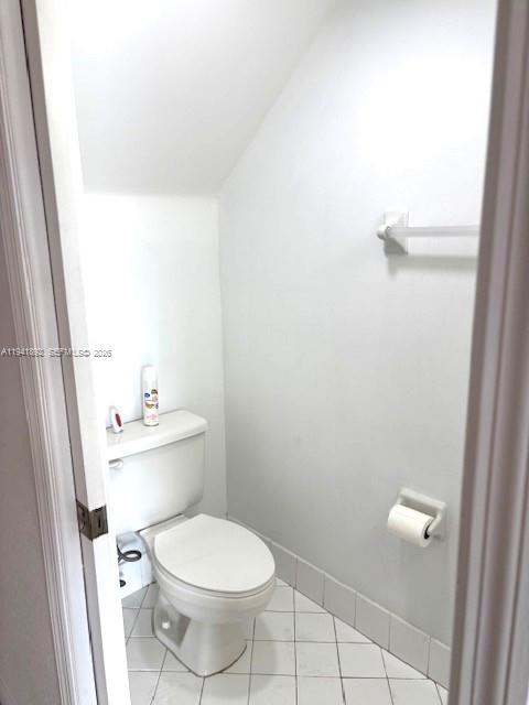 14045 Southwest 121st Place, Unit 524 Miami, FL 33186 - Photo 15 of 46 a white toilet sitting next to a white sink and vanity