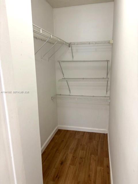 14045 Southwest 121st Place, Unit 524 Miami, FL 33186 - Photo 33 of 46 a view of a room with racks on the wall