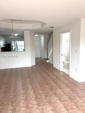 a view of a room that has a window in it