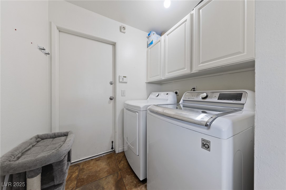 2637 Rialto Road Las Vegas, NV 89108 - Photo 9 of 22 Laundry area with separate washer and dryer and cabinet space