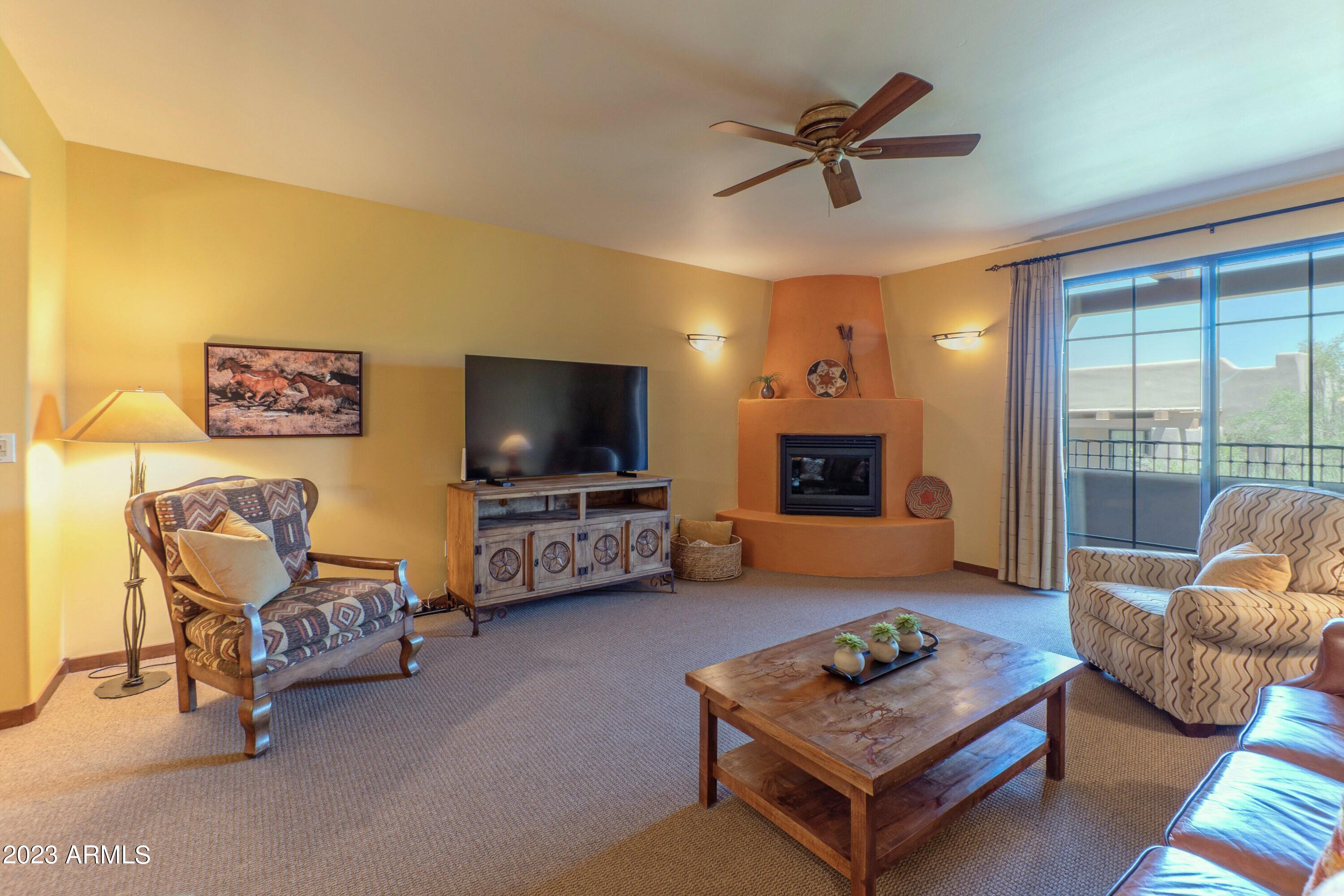 36601 North Mule Train Road, Unit C37 Carefree, AZ 85377 - Photo 4 of 35 Living Room with Beehive Gas Fireplace