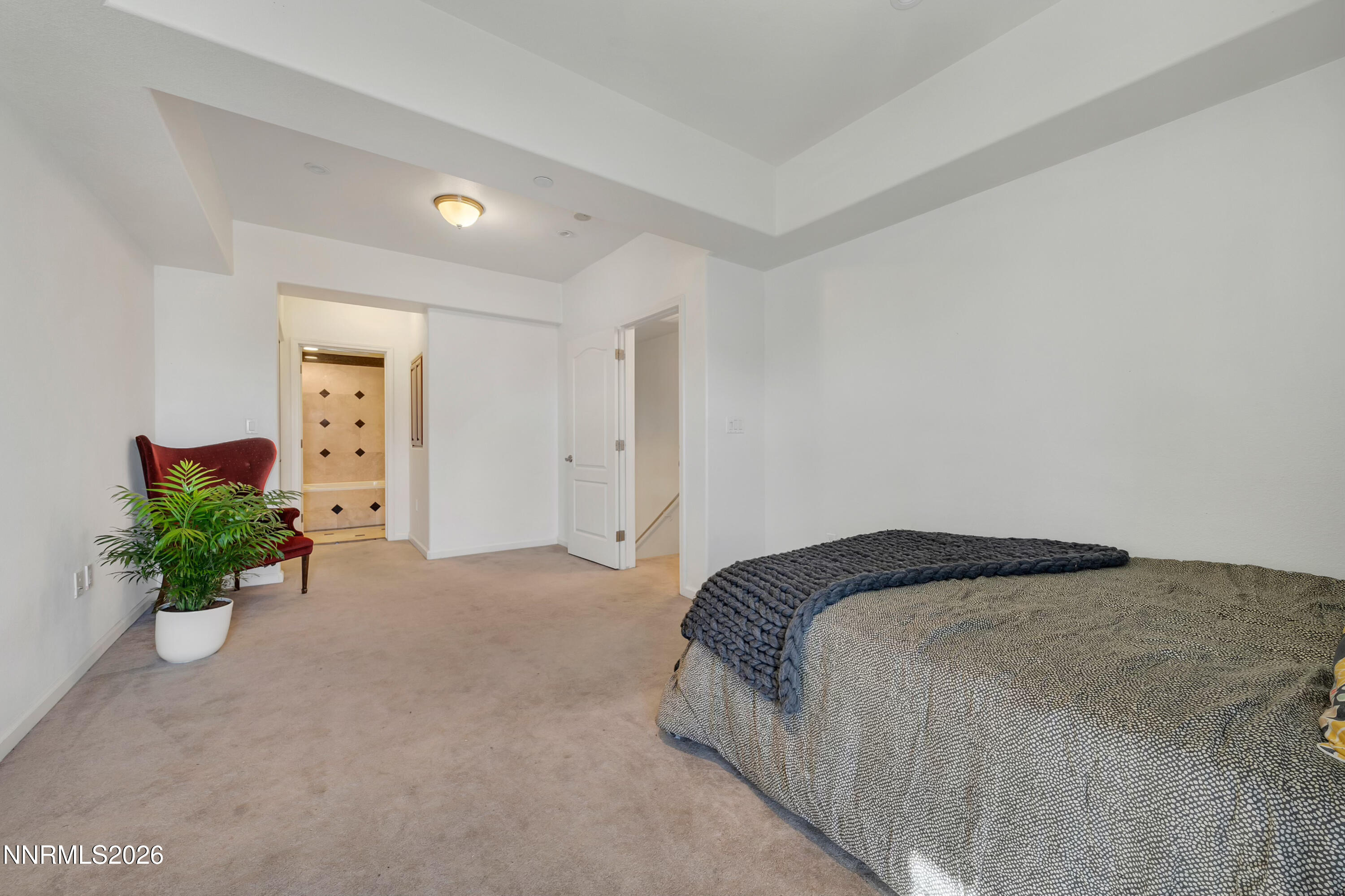 200 West 2nd Street, Unit 705 Reno, NV 89501 - Photo 7 of 11 a bedroom with a bed and a potted plant