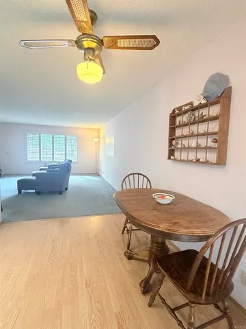 a dining room with a table and chairs