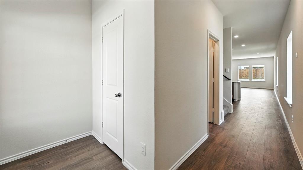 122 Pheasant Run Road Terrell, TX 75160 - Photo 21 of 36 Hallway featuring wood-finish flooring, recessed lighting, and white baseboards