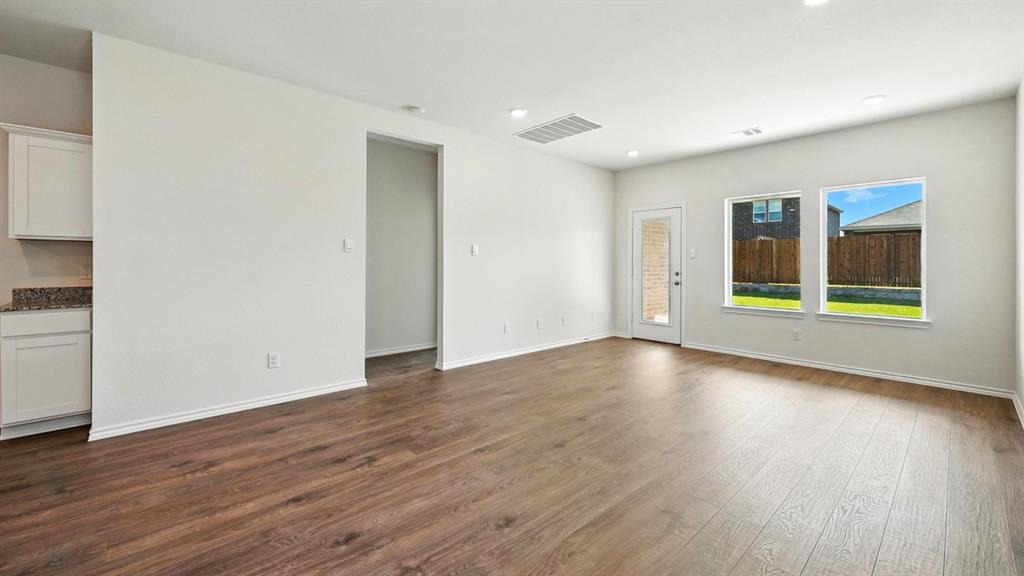 122 Pheasant Run Road Terrell, TX 75160 - Photo 35 of 36 Spacious common area featuring wood-finish flooring, recessed lighting, and light gray wall paint