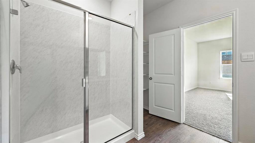 122 Pheasant Run Road Terrell, TX 75160 - Photo 3 of 36 Walk-in shower with clear glass enclosure and chrome fixtures