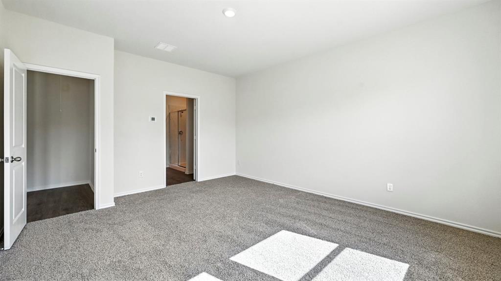 122 Pheasant Run Road Terrell, TX 75160 - Photo 8 of 36 Spacious room featuring light gray carpet flooring and white painted walls