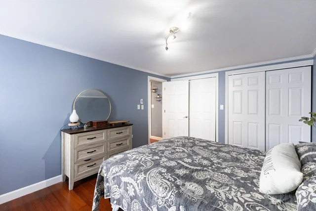 a bedroom with a bed and a view of bedroom