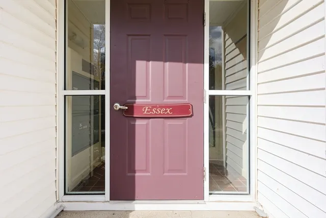 a view of a door and wooden floor