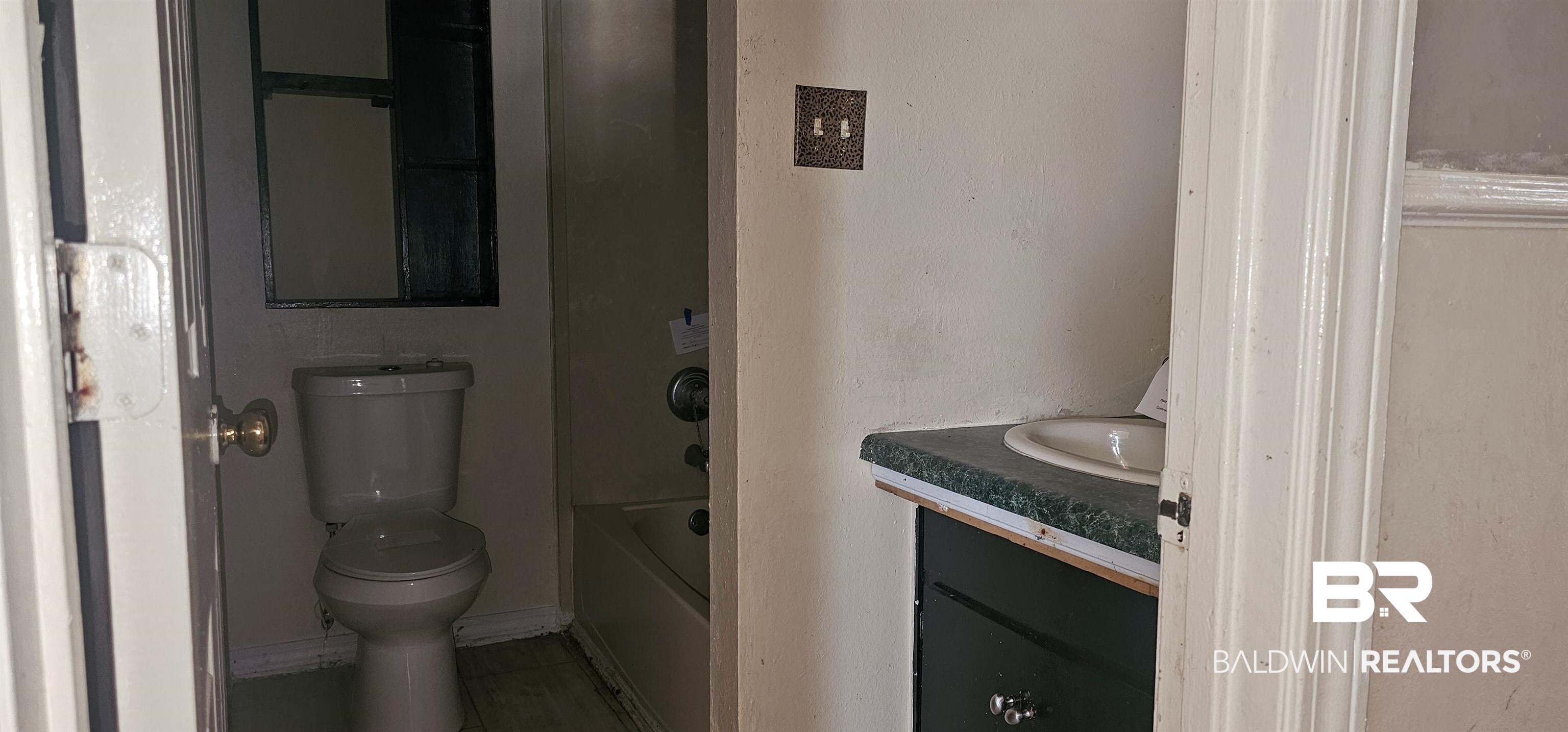 151 Bullard Street Atmore, AL 36502 - Photo 8 of 38 Bathroom with vanity and toilet