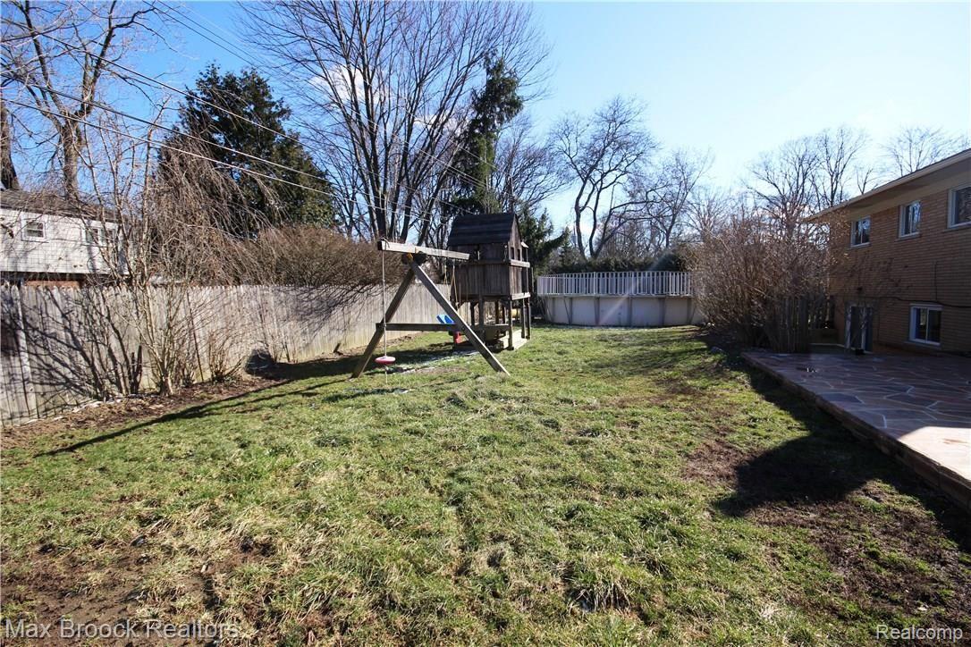 3770 Beach Road Troy, MI 48084 - Photo 27 of 31 Great size yard with playset and above ground pool.