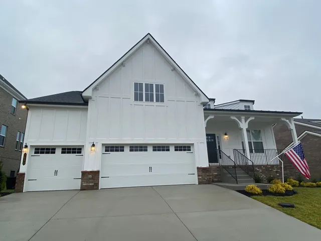 a front view of a house with garage