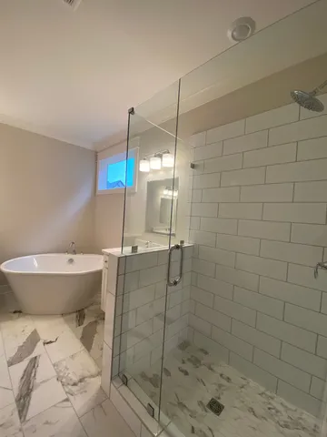 a bathroom with a toilet and shower