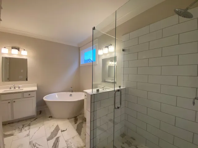 a bathroom with a toilet sink shower and mirror