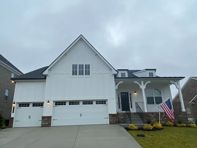 a front view of a house with garage