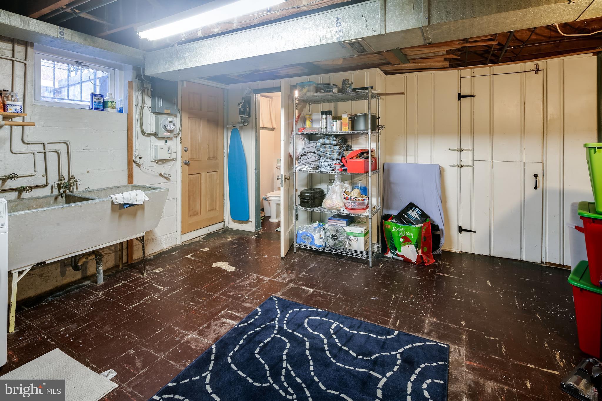 412 Greenlow Road Baltimore, MD 21228 - Photo 22 of 26 Lower level storage & laundry area w/walk up stair